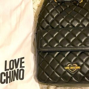 ❤️Love moschino❤️backpack in black with red lining inside the bag.